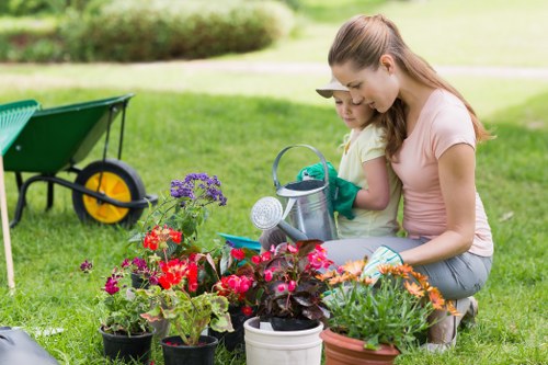 Gardening team conducting corrective work in a suburban garden